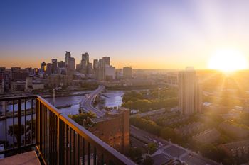 Sunrise over the city from a rooftop terrace